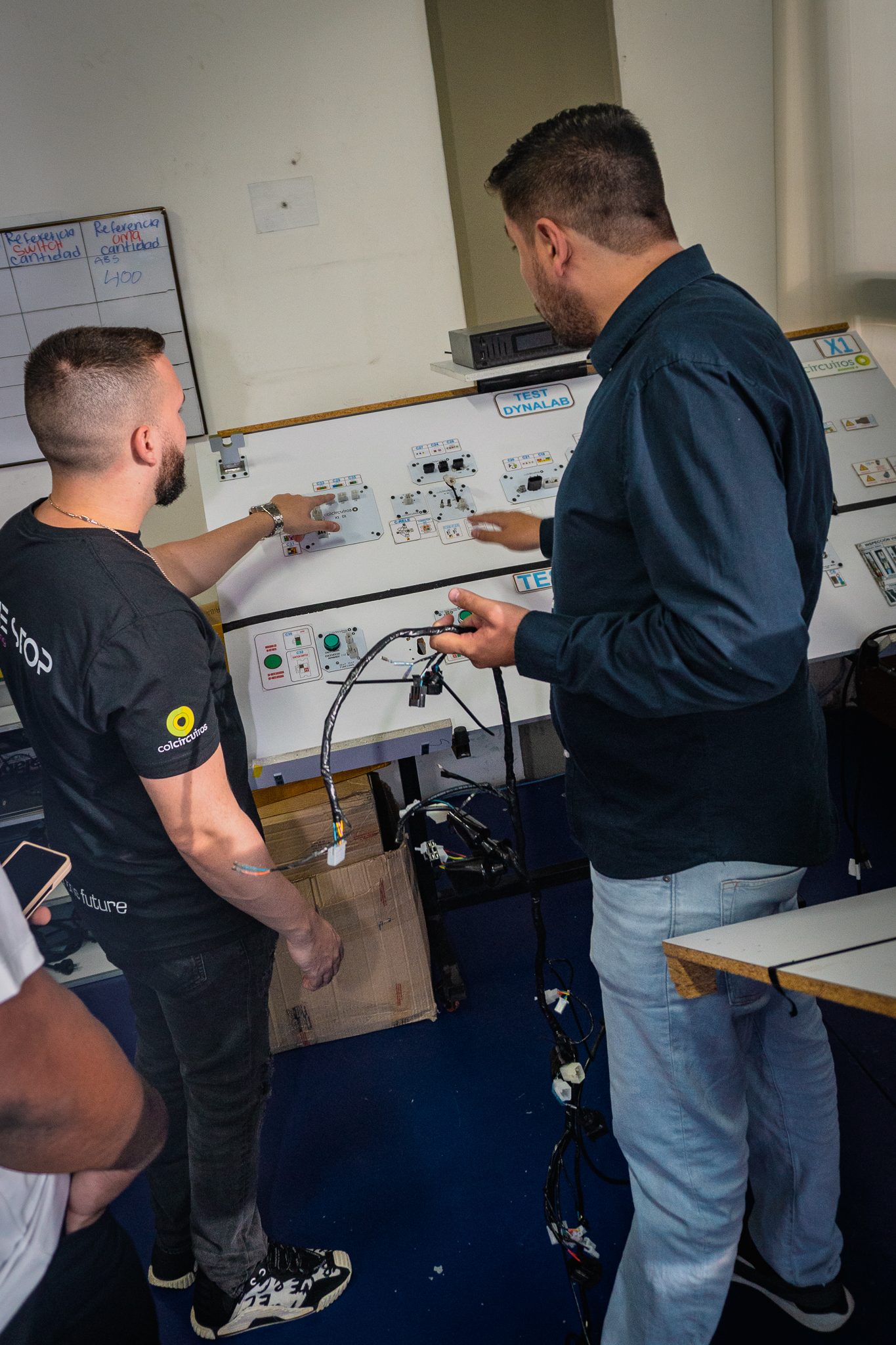 Engineers testing circuit boards at the Medellín lab
