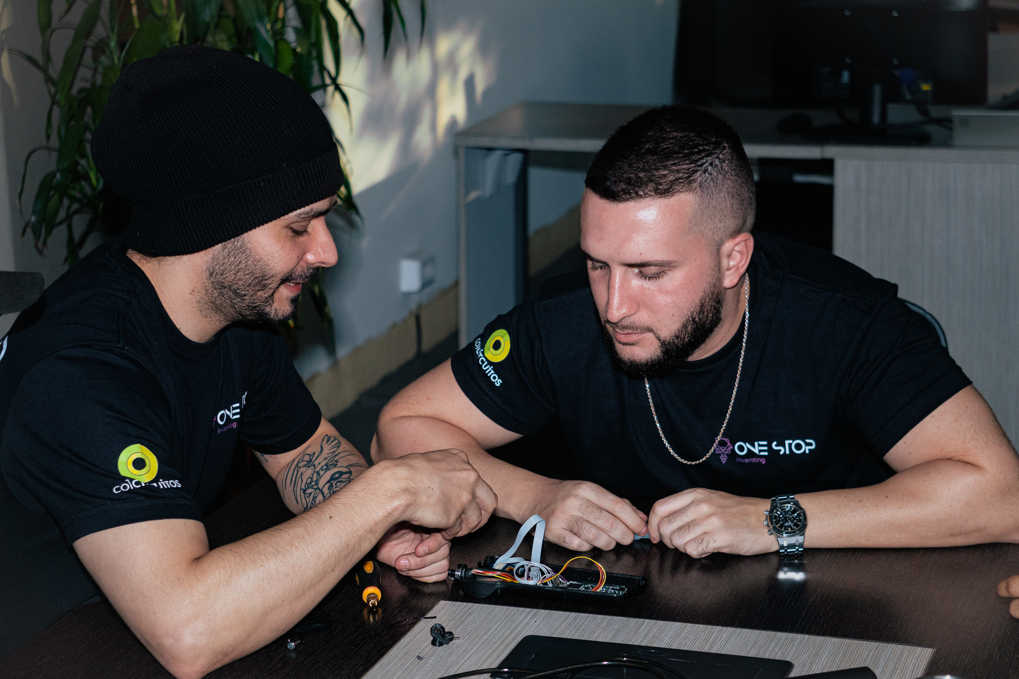 Team members assembling an electronic prototype