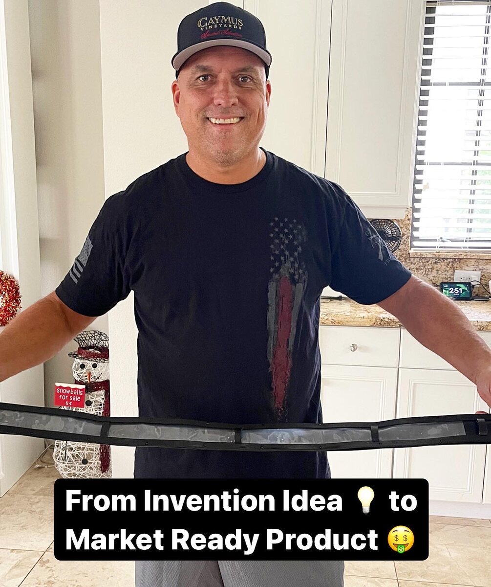 Inventor holding a curved product prototype with a message about reaching the market